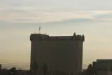 Boulder Station hotel tower with corner turrets and its name across the top in hazy morning light