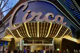 Illuminated Circa script sign above a gold-lit entrance canopy on Fremont Street at night