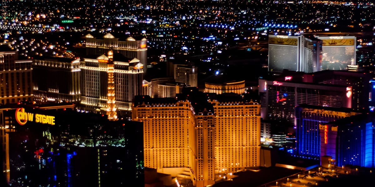 Las Vegas Strip resorts lit up at night, seen from a helicopter above Paris Las Vegas