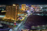 Las Vegas Strip resort towers lit up at night, seen from high above Las Vegas Boulevard