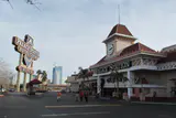 Palace Station's clock tower entrance and tall roadside sign under a pale sky