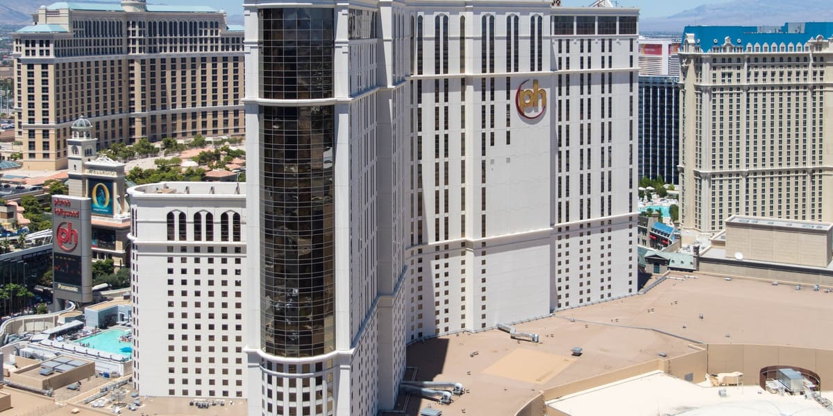 Planet Hollywood's hotel tower with its PH logo, seen from above with Strip resorts behind