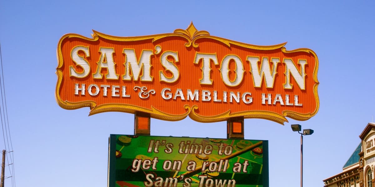 Sam's Town Hotel & Gambling Hall roadside sign with a 'Rooms Available' board below