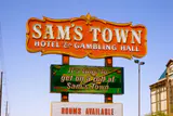 Sam's Town Hotel & Gambling Hall roadside sign with a 'Rooms Available' board below