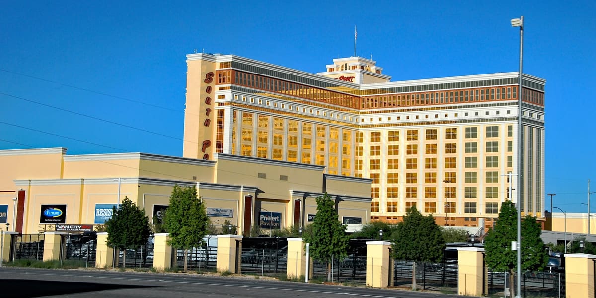 The South Point hotel tower and low casino building under a clear blue sky
